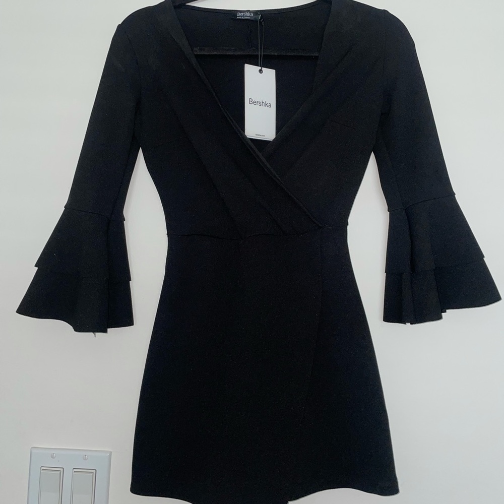 Black BERSHKA XS Romper with trumpet sleeves! Has stretch. Never worn with tag